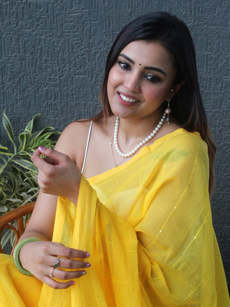 Yellow Sequinned Mul Mul Cotton Saree With Large Tassels