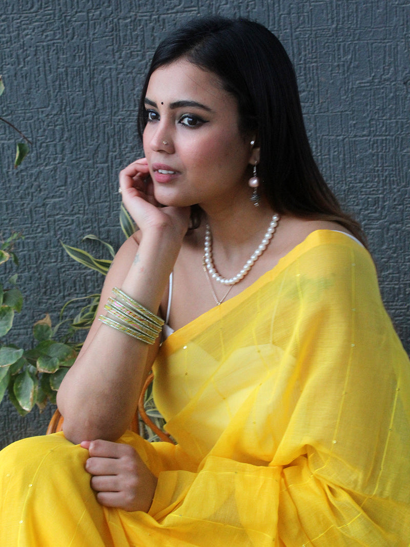 Yellow Sequinned Mul Mul Cotton Saree With Large Tassels